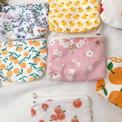 Cosbai canvas printed coin purse held in hand showing size and colorful print