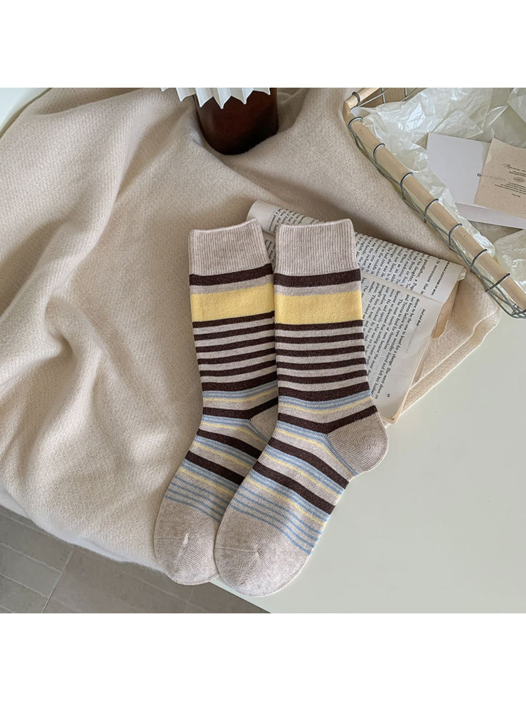 Rufia crew socks styled with rolled-up jeans to showcase bow pattern