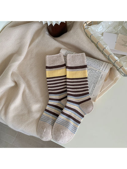 Rufia crew socks styled with rolled-up jeans to showcase bow pattern