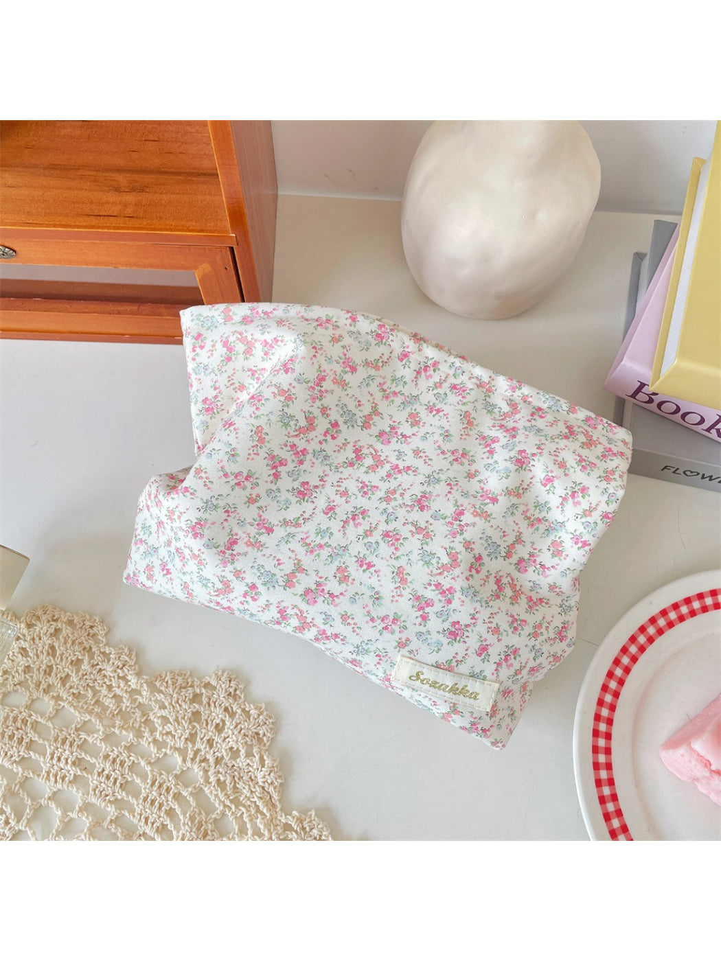 Cosbai cosmetic pouch lying flat partially open displaying interior lining