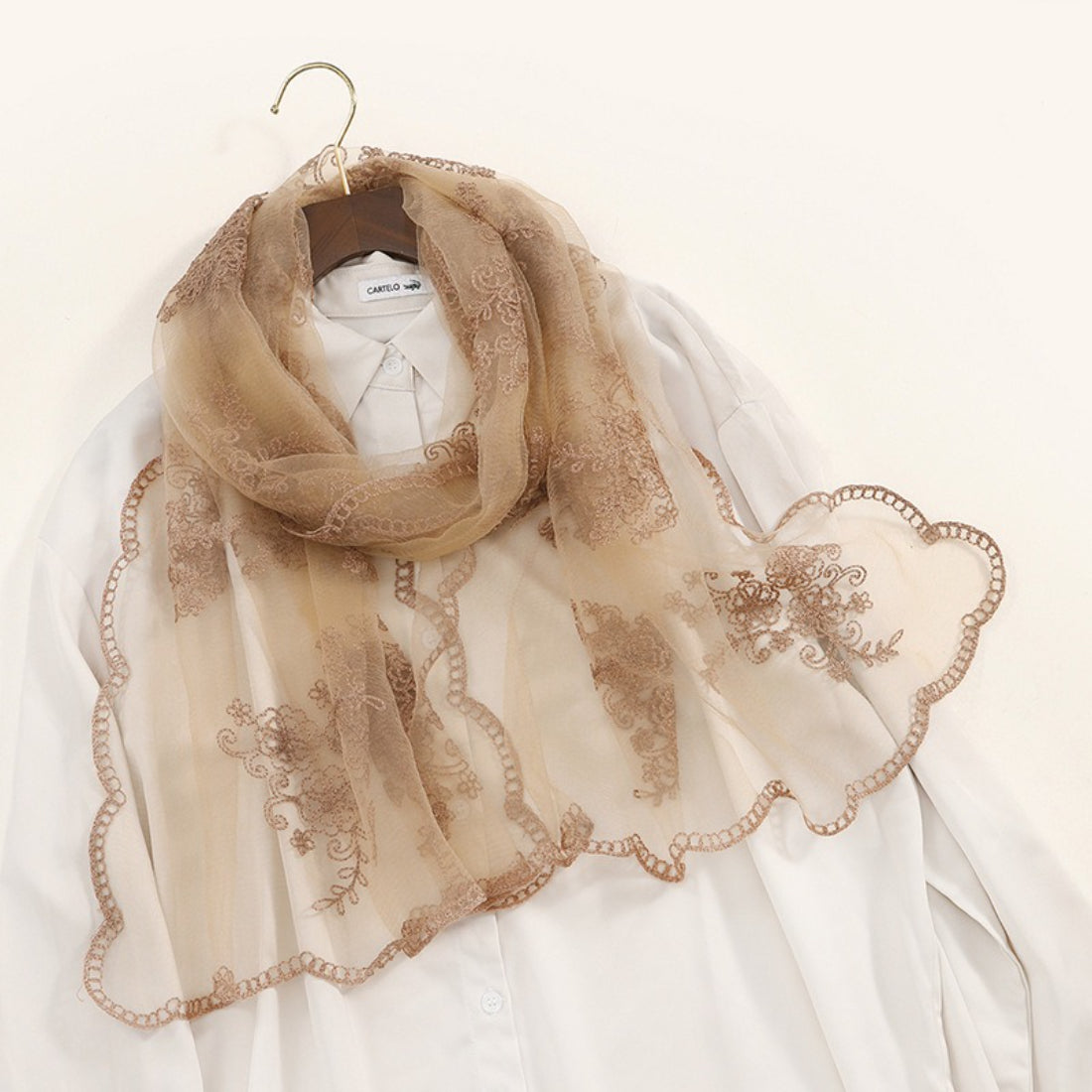 Scarvii scarf wrapped around neck showing embroidered baroque patterns