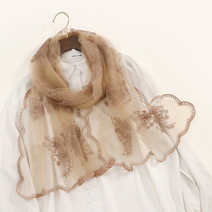 Scarvii scarf wrapped around neck showing embroidered baroque patterns