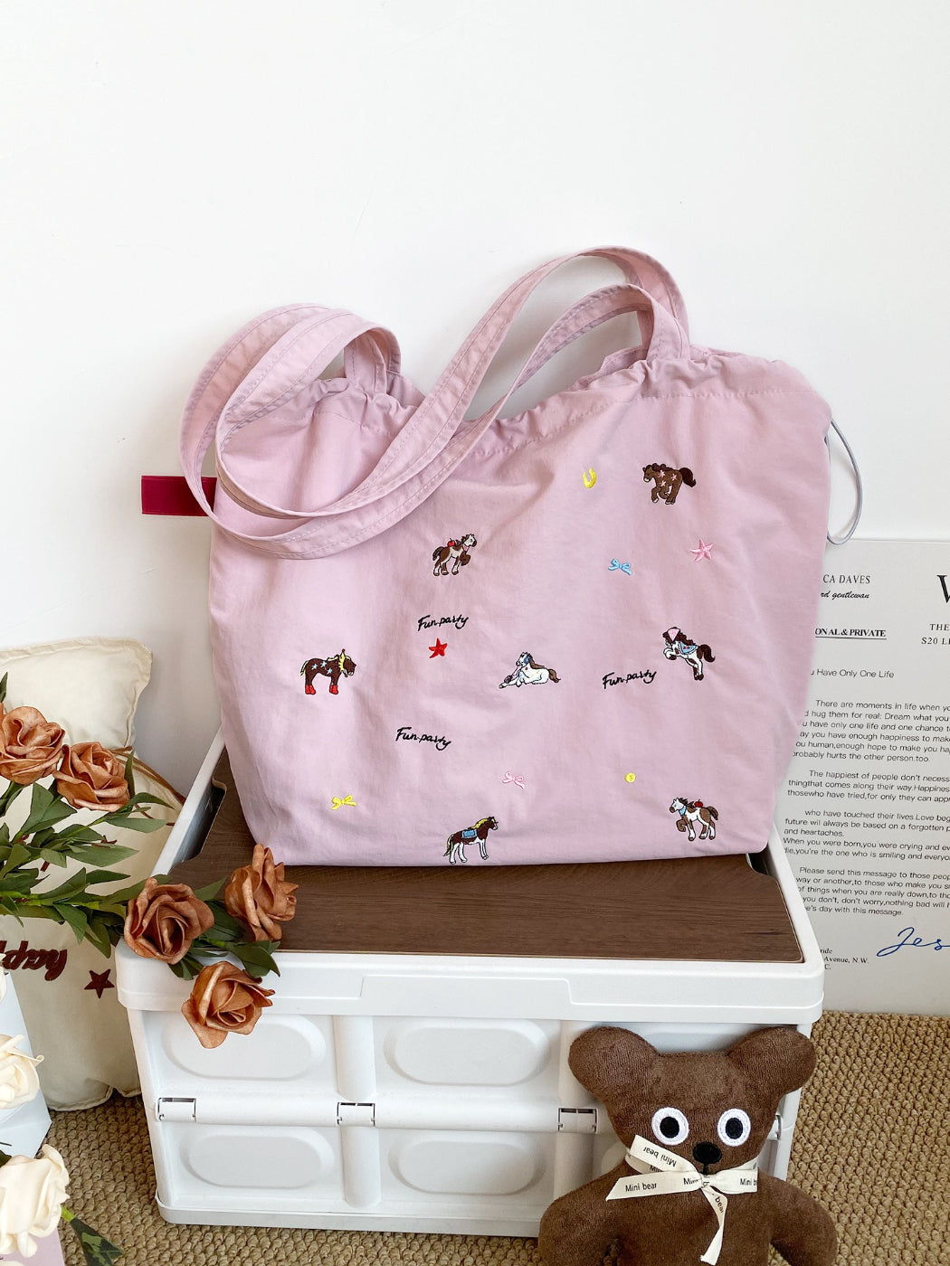 Cosbai horse print drawstring bag worn over shoulder by model