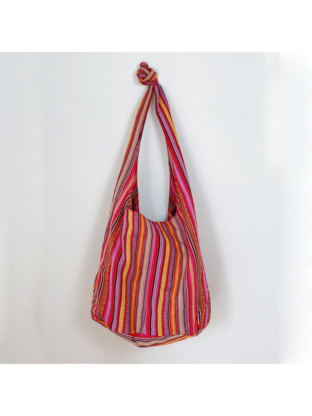 Cosbai striped slouchy crossbody bag hanging by its strap