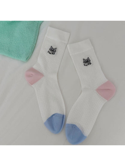 Multiple pairs of Rufia cat knit crew socks in various pastel shades