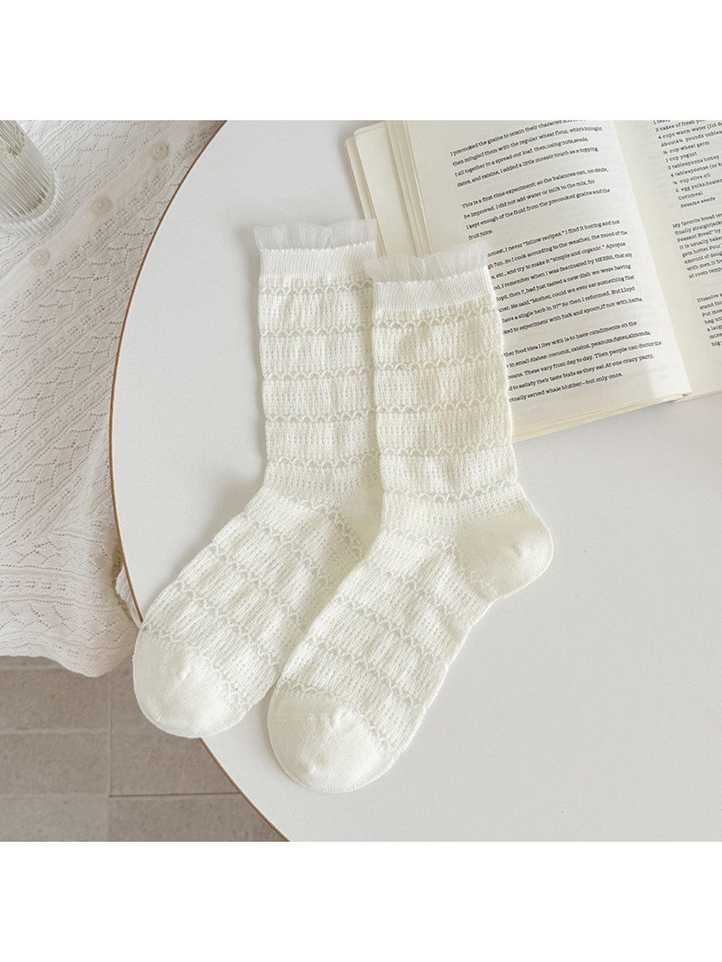 Multiple color options of Rufia ruffle socks arranged in a fan shape