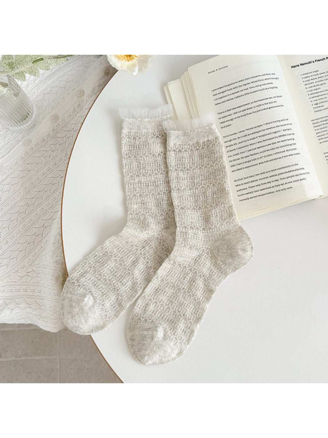 Rufia socks folded neatly highlighting soft fabric and ruffle detail