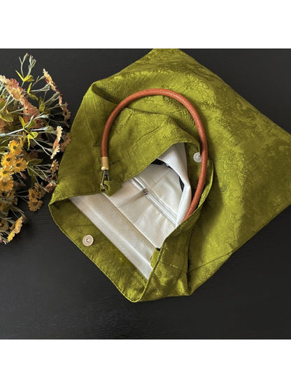 Interior view of vintage olive slouch tote displaying spacious