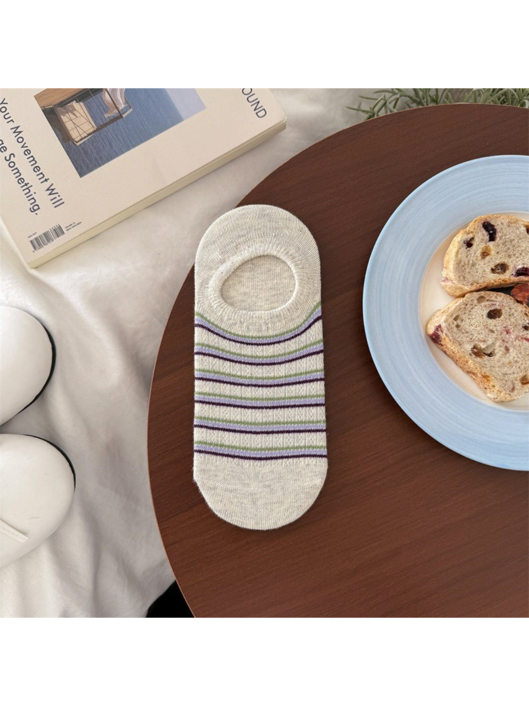 Rufia low cut socks paired with casual shoes on wooden floor