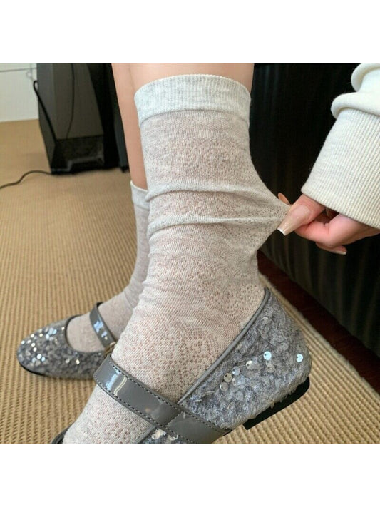 Close-up of Rufia floral mid-calf socks showing detailed flower design on fabric