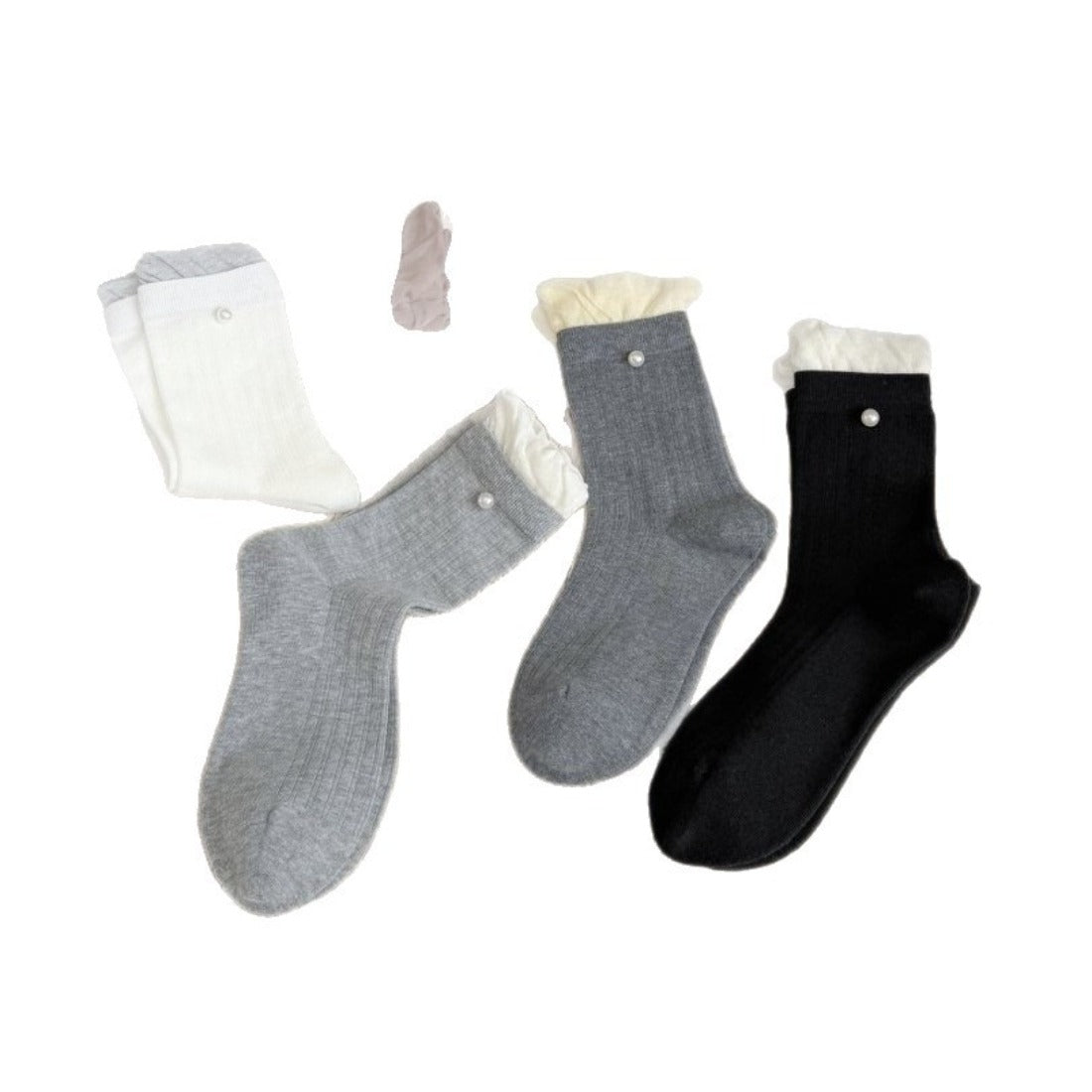 Rufia ribbed crew socks displayed flat showing full length and ruffle trim