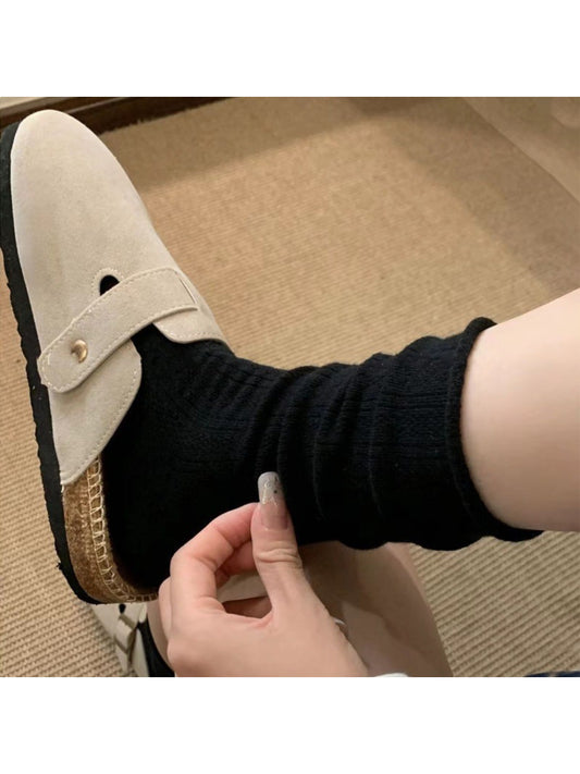 Close-up of white mid-calf sock showing texture and knit pattern