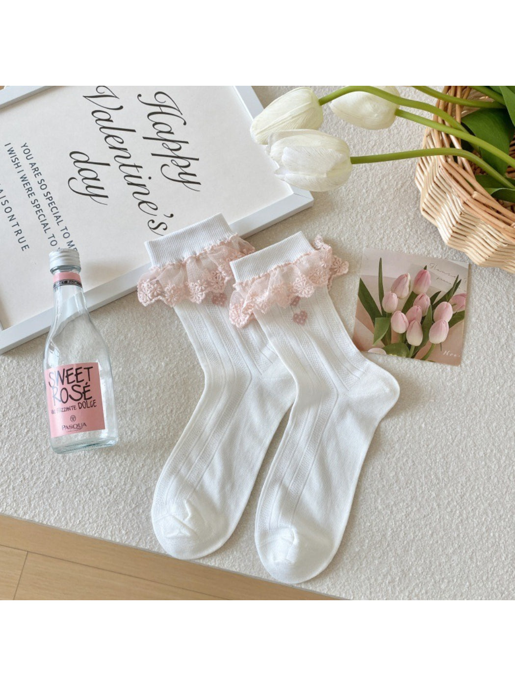 Top view of Rufia soft girly accent crew socks laid flat on white background