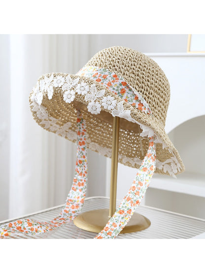 Close-up of Haila bucket hat highlighting lace trim and floral band design