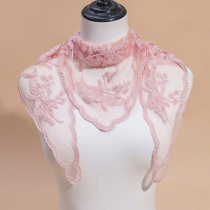Model adjusting Haila embroidered lace veil head scarf in natural light