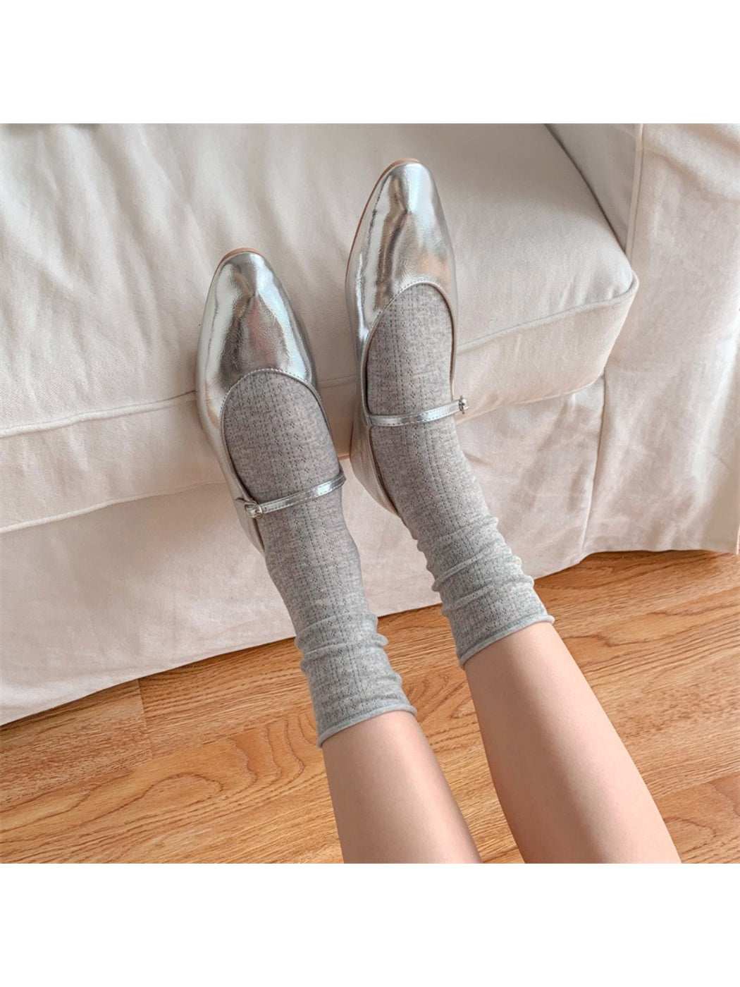 Model wearing beige Rufia rolled edge textured crew socks with casual shoes