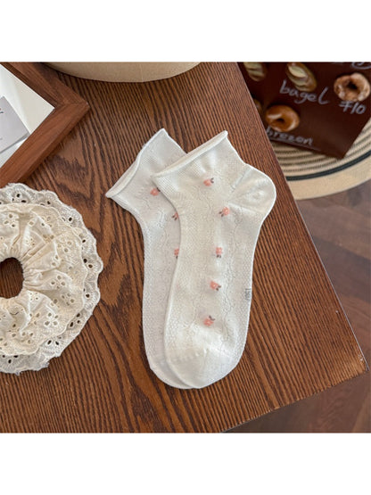 Rufia socks folded to show floral pattern and elastic cuff