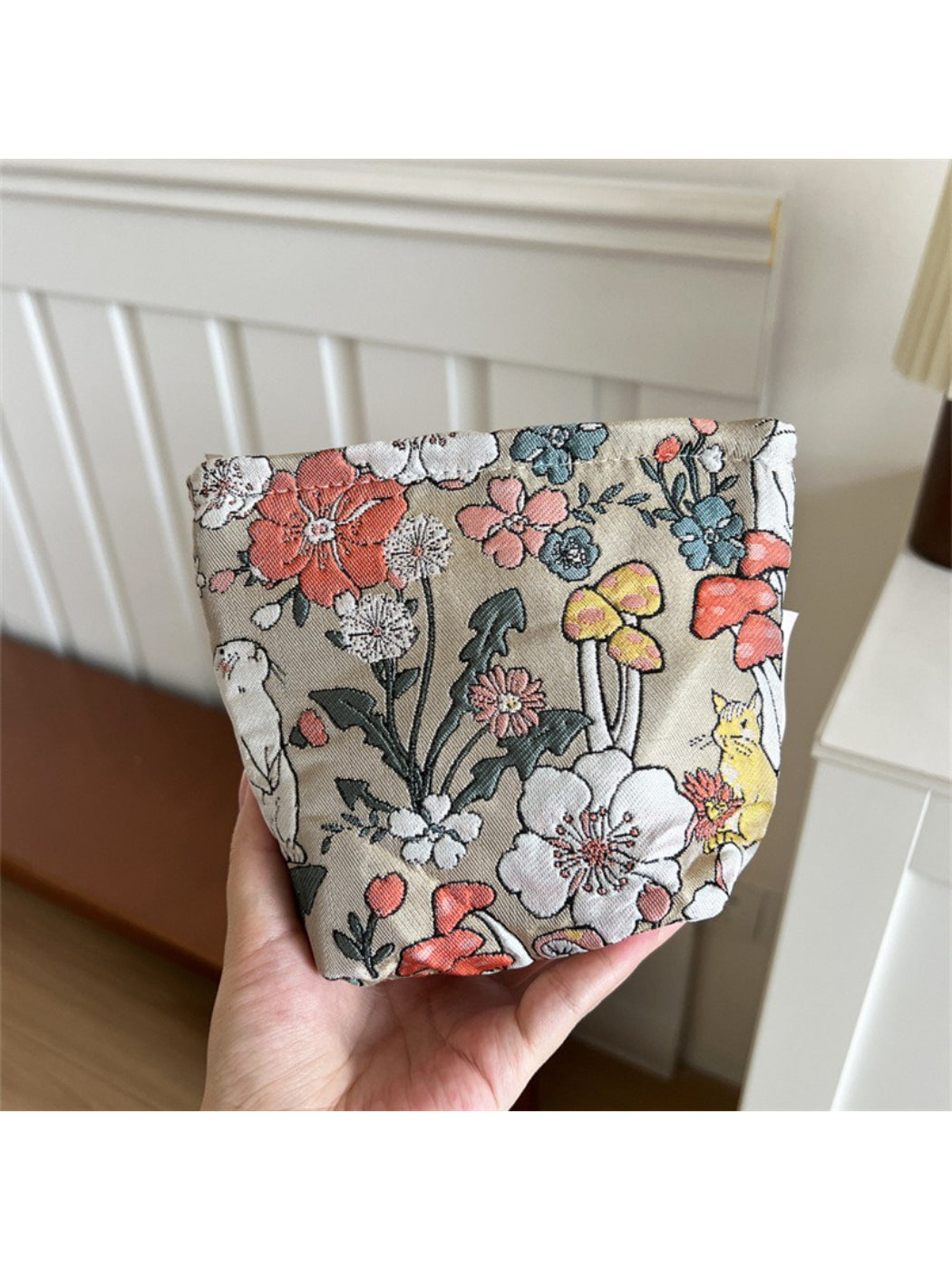 Cosbai Floral Bunny Makeup Pouch placed on a flat surface with floral and bunny print visible