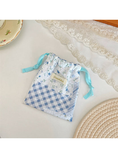 Cosbai floral patchwork pouch open with drawstring pulled to reveal interior