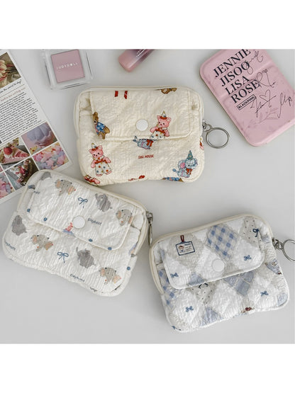 Cosbai soft quilted travel pouch with cartoon animal print on light blue background