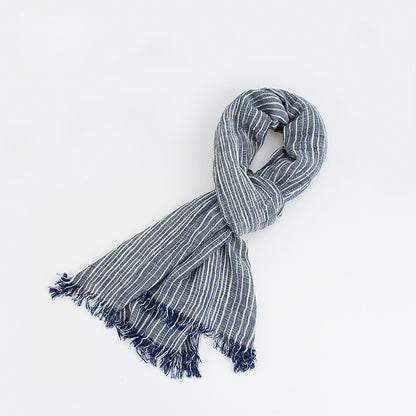 Scarvii lightweight scarf draped over chair with fringe visible