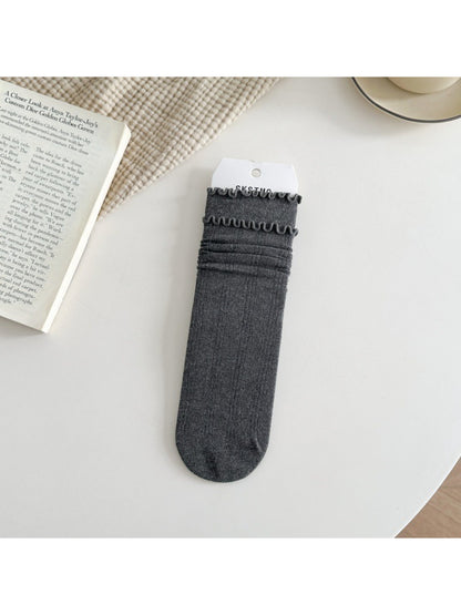 Rufia ruffle mid-calf socks in soft pink color shown from top view