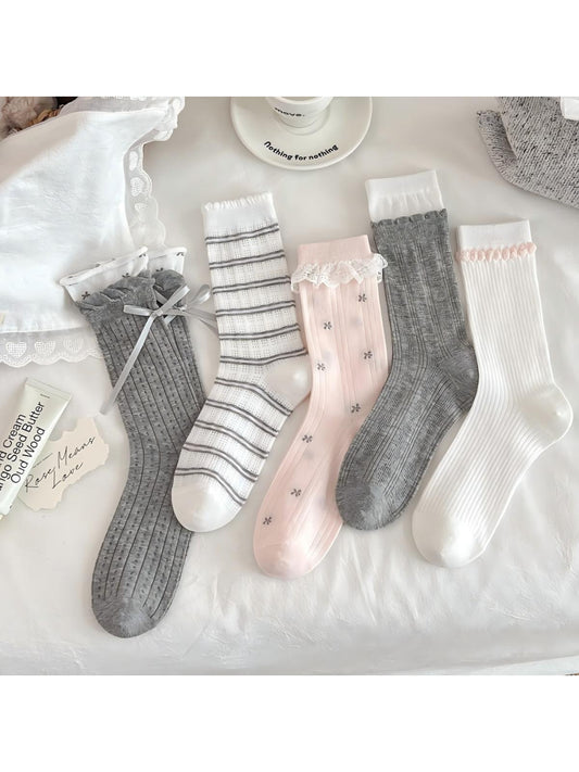 Pair of Rufia Romantic Lace Cuff Crew Socks in soft pink with delicate lace trim