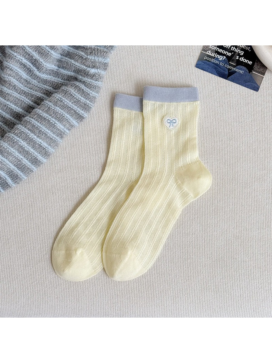 Pastel socks displayed with focus on heel and toe stitching