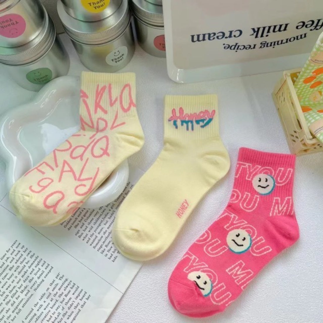 Pink ankle socks with cheerful smiley face graphic