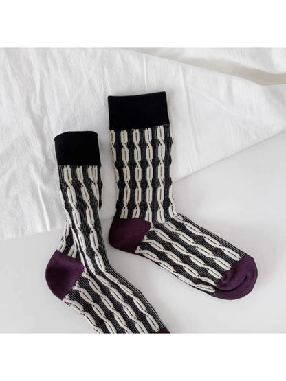 Side view of Rufia graphic knit crew socks on a model's feet