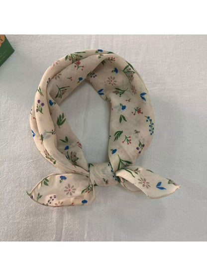 Scarf folded to display the full square shape and floral design