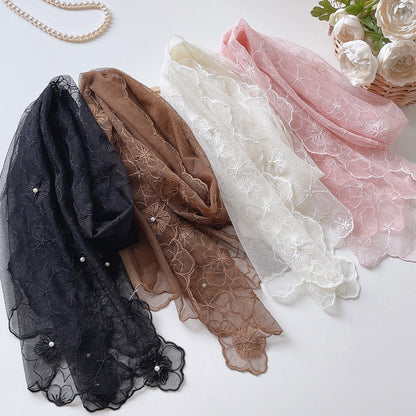 Scarvii floral lace scarf draped over a mannequin showing pearl detailing