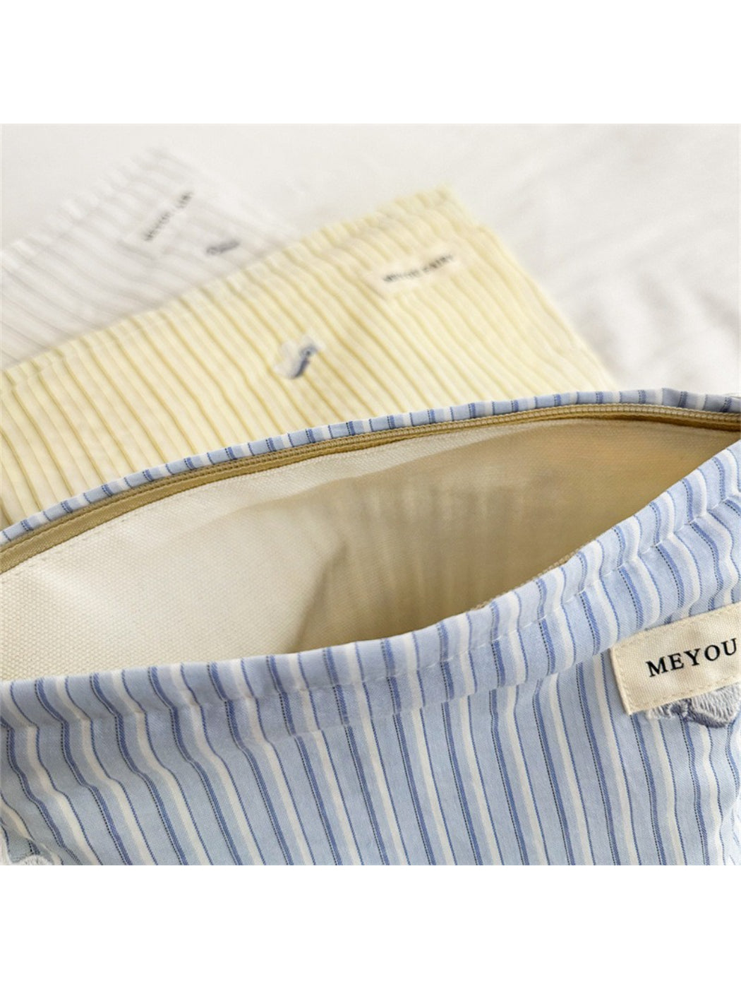 Cosbai Soft Stripe Makeup Pouch showing stitching details