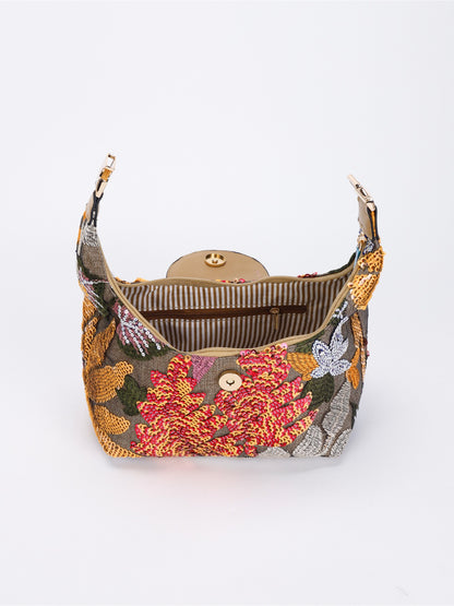 Cosbai shoulder bag displayed on white surface highlighting embroidery and sequins