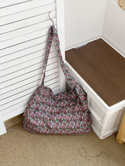 Cosbai soft floral shoulder bag resting on wooden surface with flowers