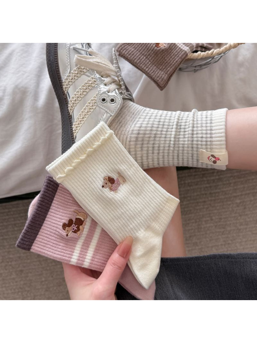Pair of Rufia dog embroidered stripe crew socks laid flat