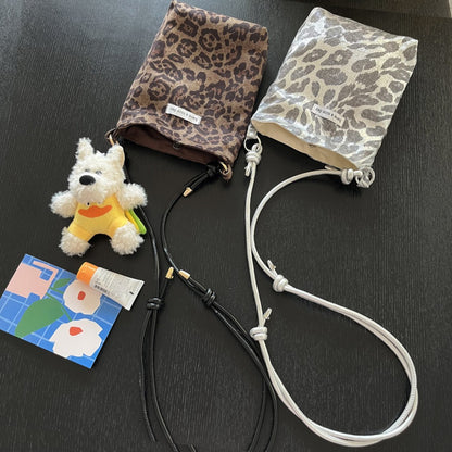 Leopard print mini crossbody pouch with adjustable cord strap