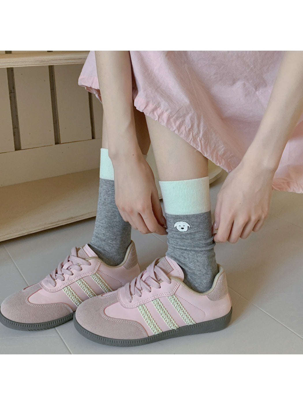 Pair of Rufia soft crew socks in light gray with embroidered cute animal face detail