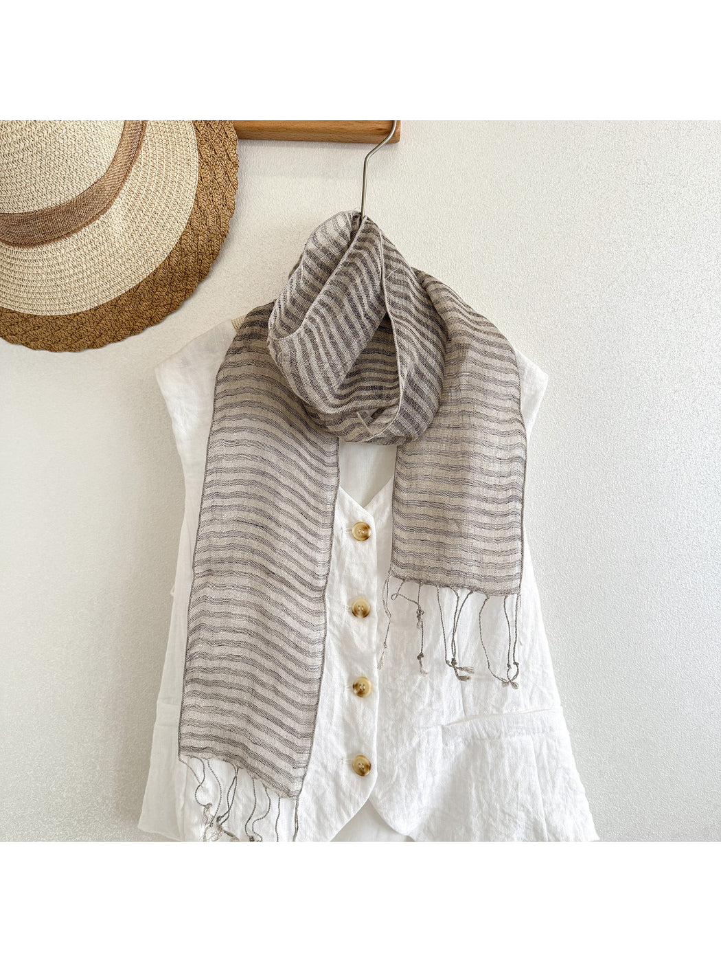 Close-up of Scarvii skinny scarf fabric texture and stripe trim