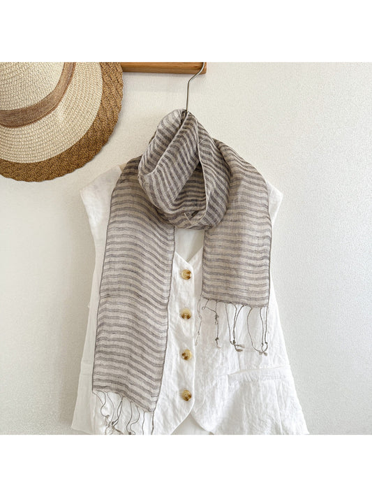 Close-up of Scarvii skinny scarf fabric texture and stripe trim