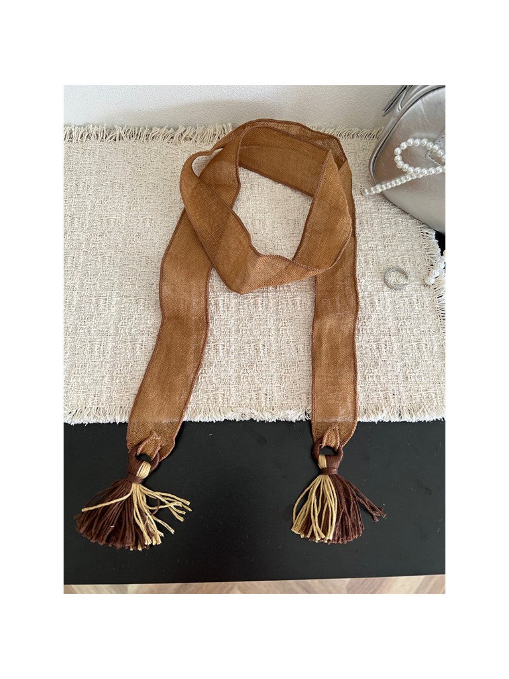 Model styling Scarvii boho tassel trim skinny scarf with casual outfit