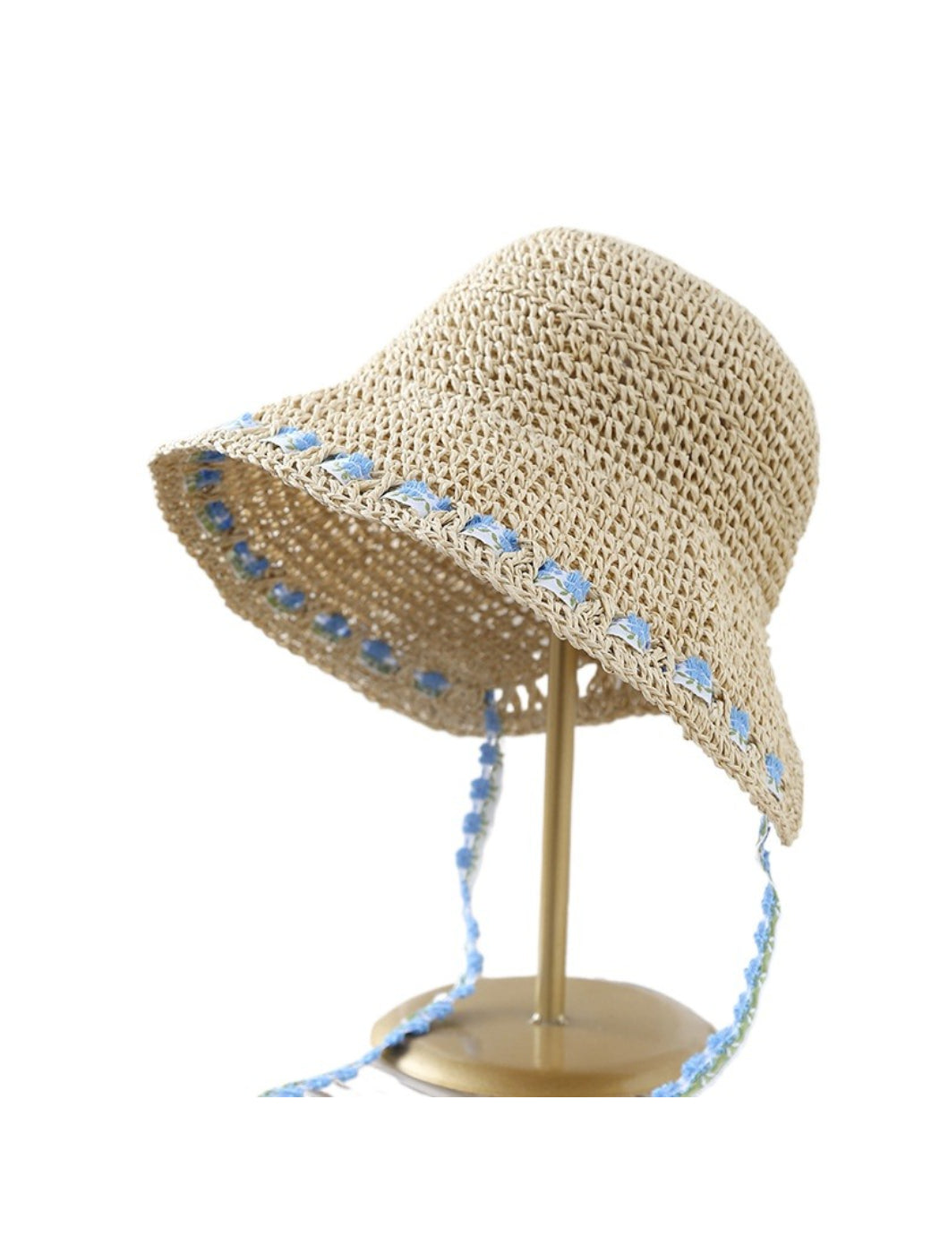 Close-up of floral trim on Haila straw bucket hat highlighting texture and pattern