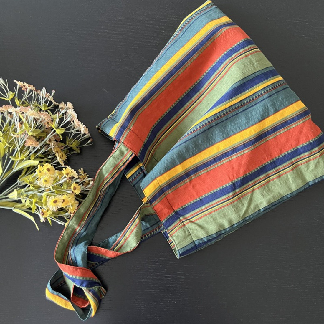 Close-up of Cosbai Boho Stripe Carryall Tote Bag handles and fabric texture
