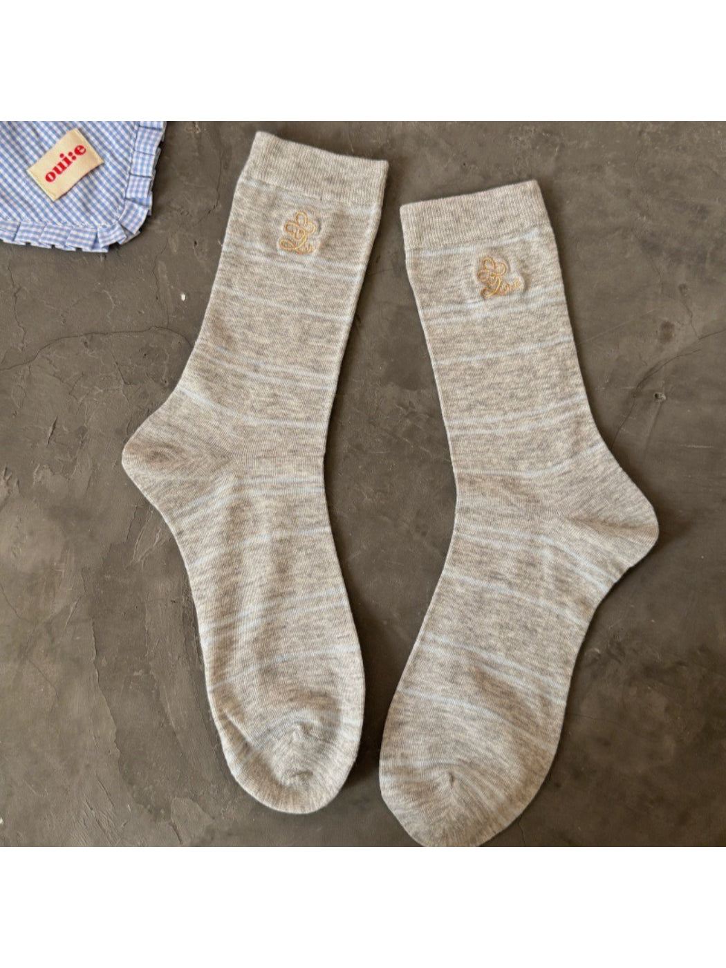 Side view of Rufia pastel stripe knit socks highlighting multicolor stripes