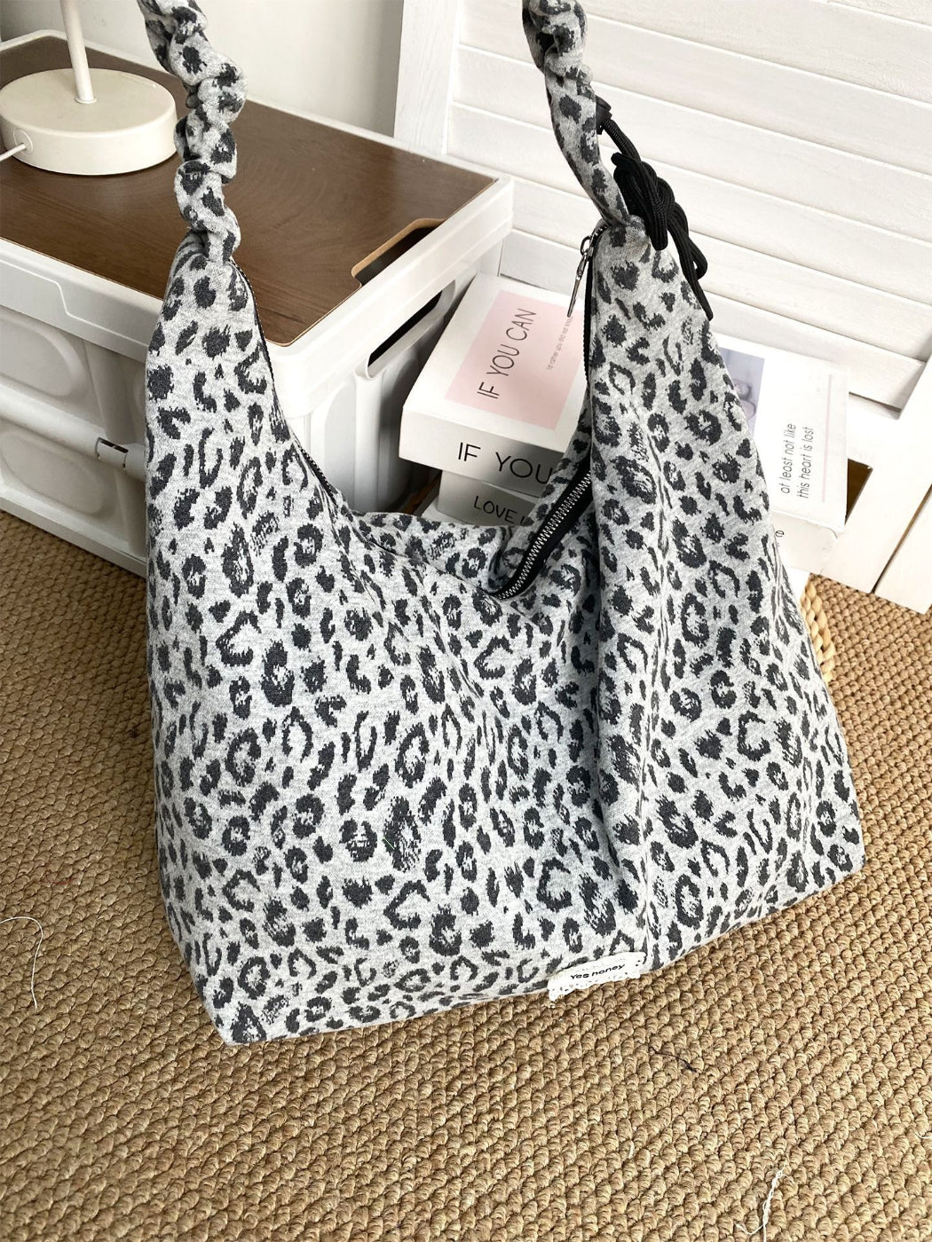 Cosbai leopard print shoulder bag displayed on model wearing casual outfit