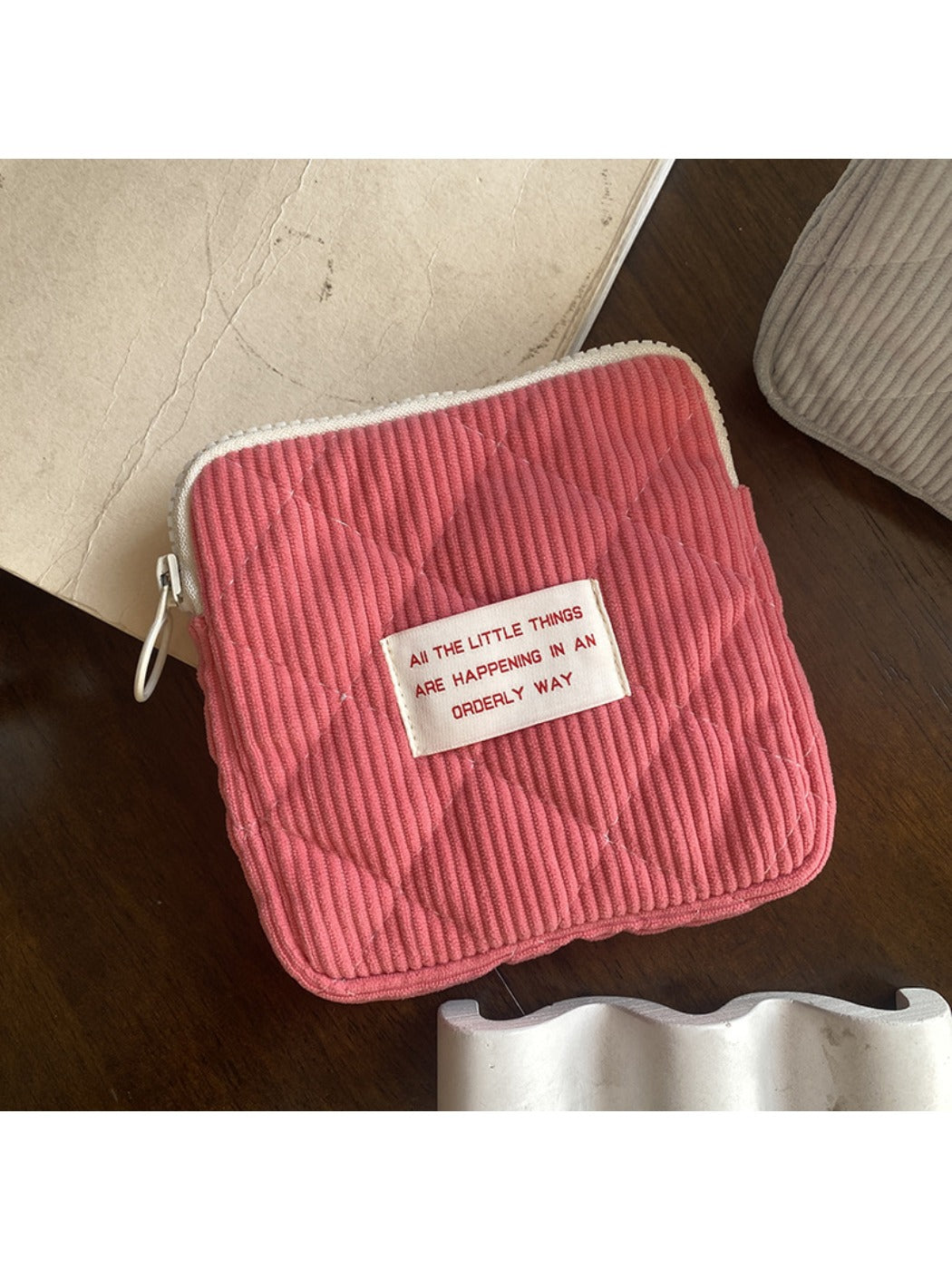 Cosbai cartoon print mini storage pouch photographed against plain background