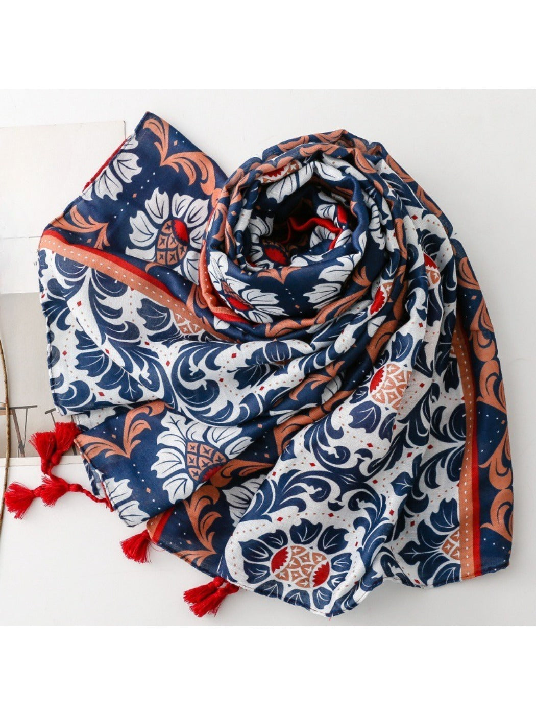 Scarvii tassel scarf draped over a chair displaying full design and tassel ends