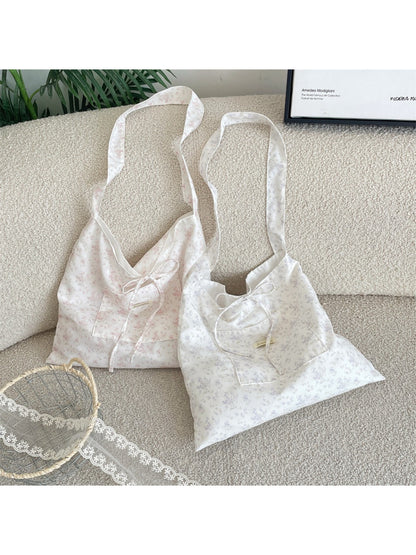 Cosbai dainty floral bow shoulder bag worn over shoulder on model