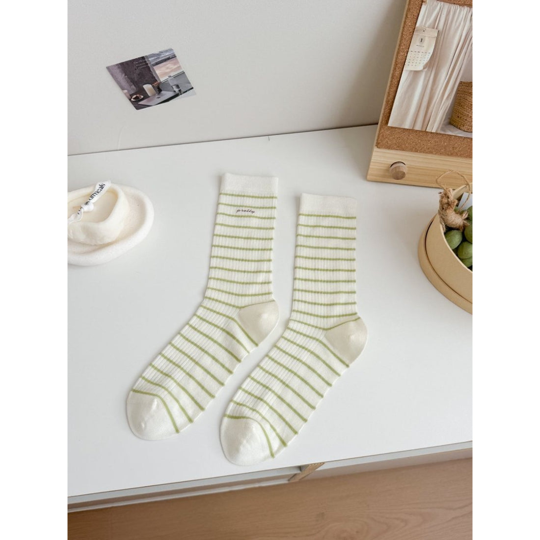Rufia Pretty Fine Stripe Crew Socks arranged with other clothing items for styling