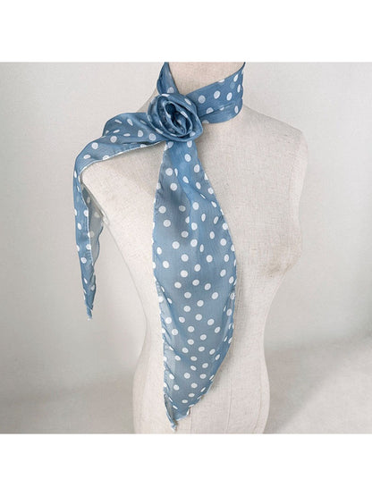 Scarf folded to show contrast between red roses and white polka dots